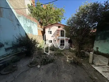 Lote (vista para casa do fundo)