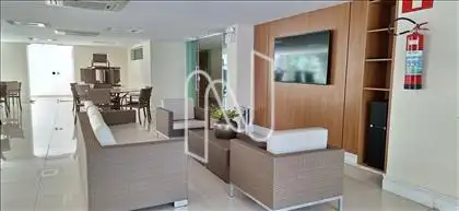 Salão de festas com área de tv 