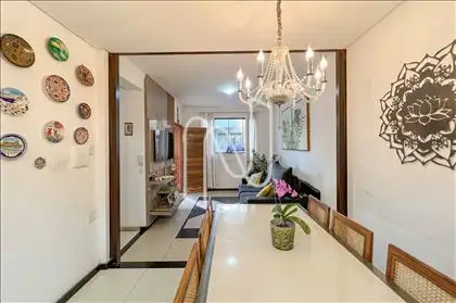 Sala de jantar conjugada com sala de TV