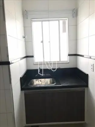 Área Serv com bancada em granito e armarios 